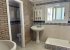 House B Bathroom with Shower and Tub and private WC.