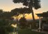 Enjoy a glass of wine and an amazing sunset at the outdoor kitchen/bar