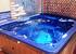Enjoy the stars and sea view in our cozy corner hot tub!